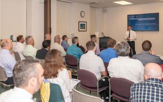 Wastewater professionals attend a presentation 
