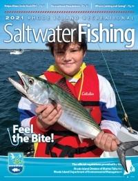 boy holding fish on cover of saltwater fishing magazine