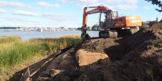 Municipal Resilience Program digging near the beach