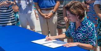 Governor Gina M. Raimondo signs the Executive Order to Tackle Plastics.