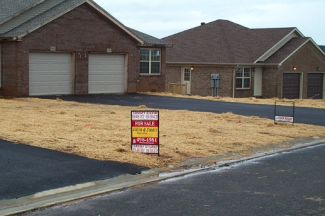 straw and mulch on front lawn