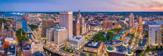 Aerial panorama of Providence skyline at dusk. Providence is the capital city of the U.S. state of Rhode Island. Founded in 1636 is one of the oldest cities in USA. Copyright (c) 2019 Mihai_Andritoiu/Shutterstock.