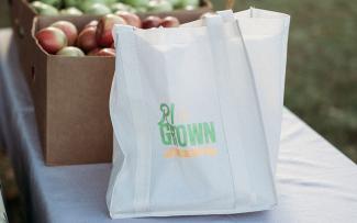 Reusable shopping bag with the RI Grown logo
