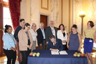 Earlier this month, Governor McKee signed a proclamation designating October as Farm to School Month. RI Secretary of Commerce Liz Tanner, DEM Director Terry Gray, DEM Division of Agriculture and Forestry Chief Ken Ayars, DEM Agriculture staff, and members of the RI Farm to School leadership council – which includes representatives from the Rhode Island Department of Education, Chartwells, and Farm Fresh RI – joined. Attendees crunched apples provided by Steere Orchard in Greenville.