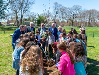 US Senator Jack Reed, US Senator Sheldon Whitehouse, Governor Dan McKee, Cranston Mayor Ken Hopkins, DEM Director Terry Gray, Technical Director John Campanini of the RI Tree Council, and students from the Oaklawn Elementary School celebrated the 127th Arbor Day in Rhode Island at Brayton Park in Cranston. The event included a formal announcement of the Urban Forests for RI Technical Assistance Program participants, highlighting the urban tree cover initiatives in communities across RI