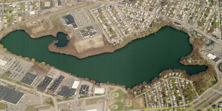Satellite image of Mashapaug Pond showing a highly developed area surrounding the water body
