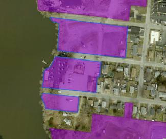 Map showing parcels highlighted in purple that were merged to account for 4.1 acres of land, of which 3.2 are impervious cover.