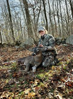 girl with harvested deer